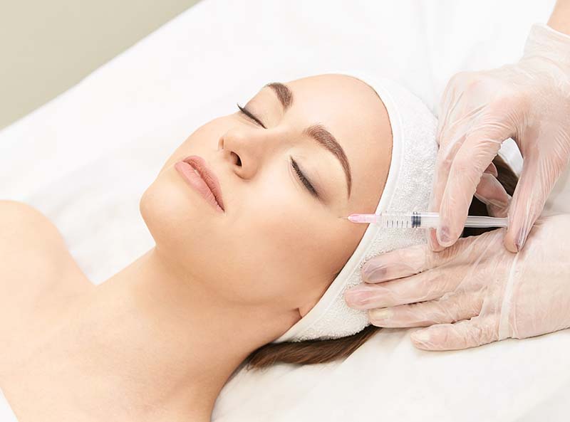 Beauty young woman recieving anti-aging injection